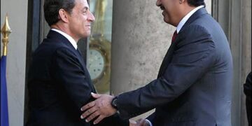 French President Nicolas Sarkozy with Qatar's foreign minister Sheikh Hamad Jabor Al Thani
