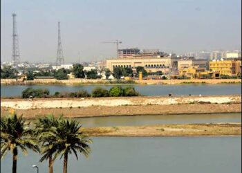 Tigris river level receding in full view of the Iraqi High Tribunal and US Embassy, Baghdad, Iraq