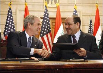 U.S. President George W. Bush and Iraqi Prime Minister Nuri al-Maliki shake hands following the signing of the Strategic Framework Agreement and Security Agreement at a joint news conference on December 14, 2008, at the Prime Minister's Palace in Baghdad, Iraq. Photo: The White House