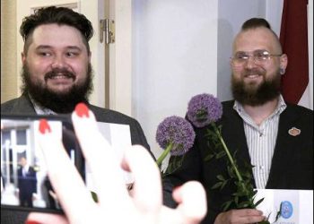 The first couple who have registered a same-sex partnership in Latvia, Maksims (Di) Ringo and Janis Locs, pose for a photo in Riga, Latvia, June 2024. Photo: Latvian TV3/tv3.lv