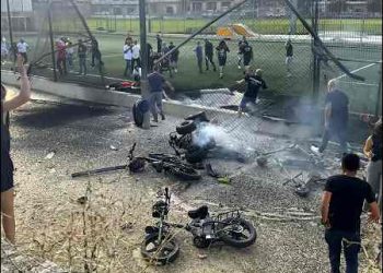 Residents rush to help injured children moments after a Hezbollah rocket attack hit a soccer field in the Druze town of Majdal Shams in the Golan Heights, Israel, July 27, 2024. Photo: AP