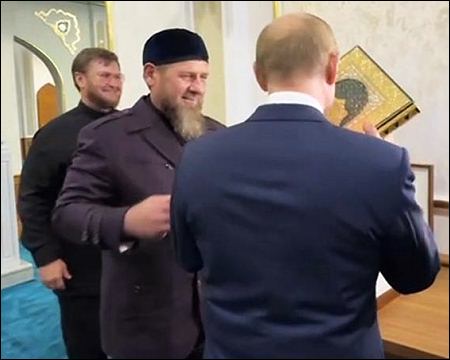 Putin kisses Islamic Quran during Chechnya visit