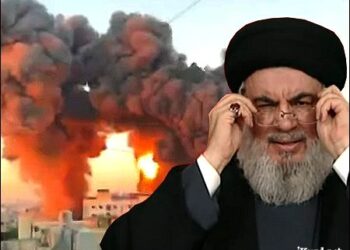 A photo of Lebanon's Hezbollah leader, Sayyed Hassan Nasrallah, from his final video address on September 19, 2024, with the backdrop showing the explosion from the Israeli strike that killed him on September 27, 2024. Photo: iKurd.net/SM/Hezbollah video/Hezbollah's Al-Manar TV