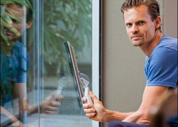 Man cleaning window
