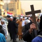 Iraqi Christians cross Muslims