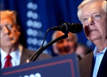 US Senator Lindsey Graham (right), R-S.C., speaks as Republican presidential candidate former President Donald Trump listens at a primary election night party in Columbia, S.C., February 24, 2024. Photo: AP