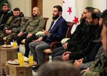 Abu Mohammad al-Golani (left), Syria's Islamist ruler and the head of Hayat Tahrir al-Sham (HTS), the former leader of al-Nusra Front affiliated to al-Qaeda, with other Islamist groups, Syria, December 24, 2025. Photo: SANA/via Reuters