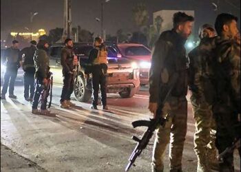 Syrian ruling HTS Islamist fighters gather during the night on a street in Damascus, Syria, December 25, 2024. Photo: AP