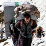 Iranian Kurdish cross-border porters known as kolbars snow mountains