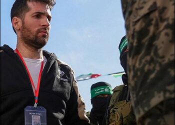 Hamas Islamist militants parade Israeli hostage Sagui Dekel-Chen on a stage before handing him over to a Red Cross team in Khan Younis, southern Gaza Strip, Israel, on February 15, 2025. Photo: AFP