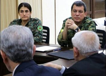 General Mazloum Abdi (far right), the commander-in-chief of the Kurdish-led Syrian Democratic Forces SDF, the de facto army of Syria's autonomous Kurdish administration in Syrian Kurdistan (Rojava), attends the meeting between the Kurdish Democratic Union Party (PYD) and the Syrian Kurdish National Council (KNC/ENKS), Hasaka, Syrian Kurdistan, Rojava, March 18, 2025. Photo: SDF/ANHA
