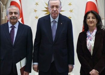Turkey's President Tayyip Erdogan (C) poses with pro-Kurdish DEM Party lawmakers Pervin Buldan (R) and Sirri Surya Onder in Ankara, Turkey, April 10, 2025. Turkish Presidency