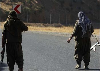 A member of the Kurdistan Workers' Party (PKK) carries an automatic rifle on a road in the Qandil Mountains, the PKK headquarters in Iraqi Kurdistan region, June 22, 2018. Photo: AFP