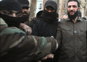Ahmed al-Sharaa, also known as Abu Mohammed al-Golani (right), the interim president of Syria, is seen with members of Hayat Tahrir al-Sham (HTS), the Islamist group he leads, Damascus, Syria, December 2024. Photo: AFP
