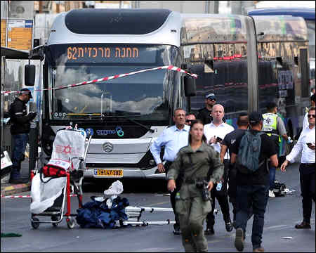 Palestinian gunmen kill 6 people at Jerusalem bus stop