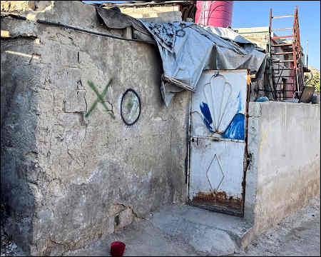 Syrian forces marked houses with X and O to empty Alawite suburb