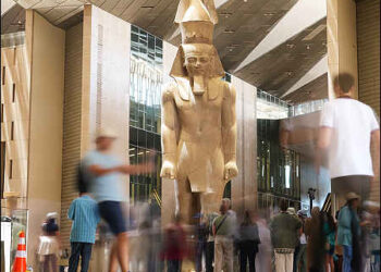 Tourists view the statue of Pharaoh Ramses II, at the Grand Egyptian Museum in Giza, Egypt, May 23, 2025. Photo: AP