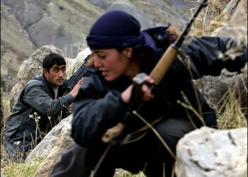 Kurdish PJAK (Partiya Jiyana Azad a Kurdistane)/HGP (Hêzên Parastina Gel HPG) female fighter in the border area in Iranian Kurdistan (Rojhelat). The PJAK has more than 3,000 armed militiamen, half the members of PJAK are women, 2016. Photo: AFP