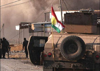 Peshmerga fighters smoke clashes fighters
