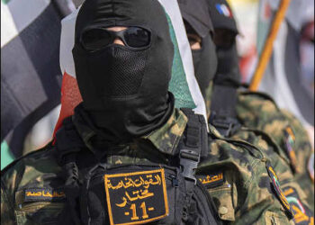 Supporters of pro-Iran Iraqi Shiite Hezbollah brigades attend a rally in military uniforms in Baghdad, Iraq, March 28, 2025. Photo: AP