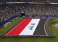 Iraqi flag is held upright above the field instead of being placed on the grass over Islamic text at FIFA World Cup in U.S., June 2026. Photo: X