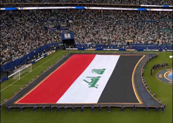 Iraqi flag is held upright above the field instead of being placed on the grass over Islamic text at FIFA World Cup in U.S., June 2026. Photo: X