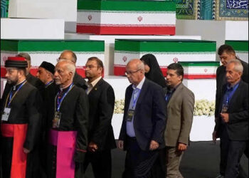 Iranian religious leaders and other mourners walk past the coffins of slain Iranian Supreme Leader Ayatollah Ali Khamenei and members of his family during a viewing ceremony ahead of the dayslong funeral ceremonies at the Imam Khomeini Mosalla Grand Mosque in Tehran, Iran, July 3, 2026.Photo: AP