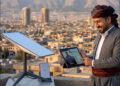 Iraqi Kurdish man starlink internet tablet dish 2026 iKurd net AI