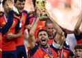 Spain's Rodri lifts the World Cup trophy alongside teammates, July 19, 2026. Photo: Reuters