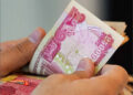 Money Iraqi dinar currency cash hands