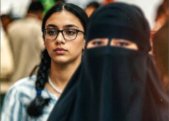 A modern Kurdish woman and a Salafi Muslim woman wearing a niqab at the Sulaimani Book Fair, in Iraqi Kurdistan, October 2025. Photo: Channel8.com/enhanced by iKurd.net